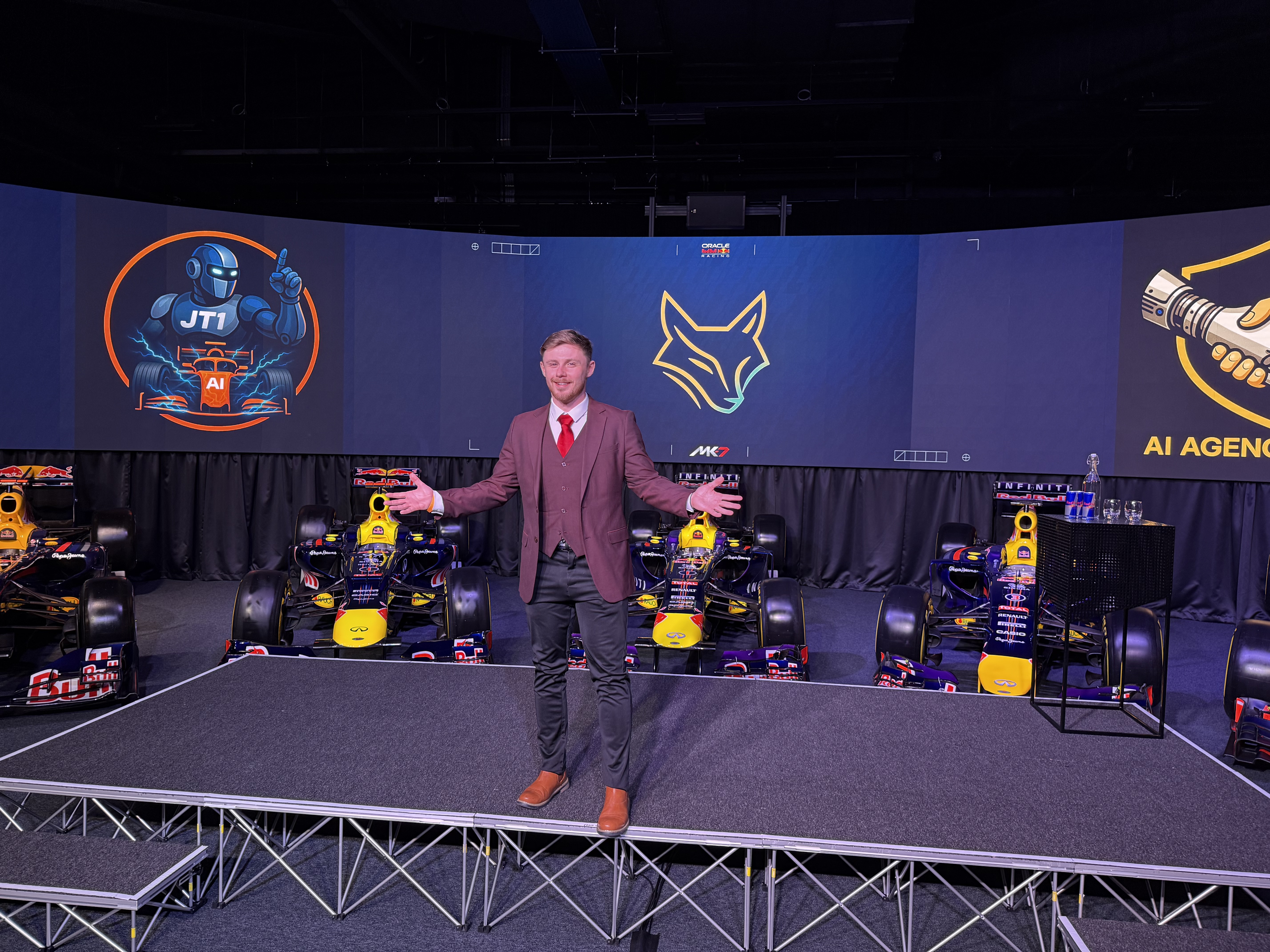 Lewis Hunter on stage with Red Bull F1 cars behind